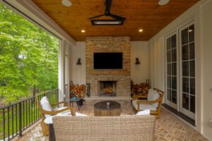 outdoor patio with screens, heaters and fireplace